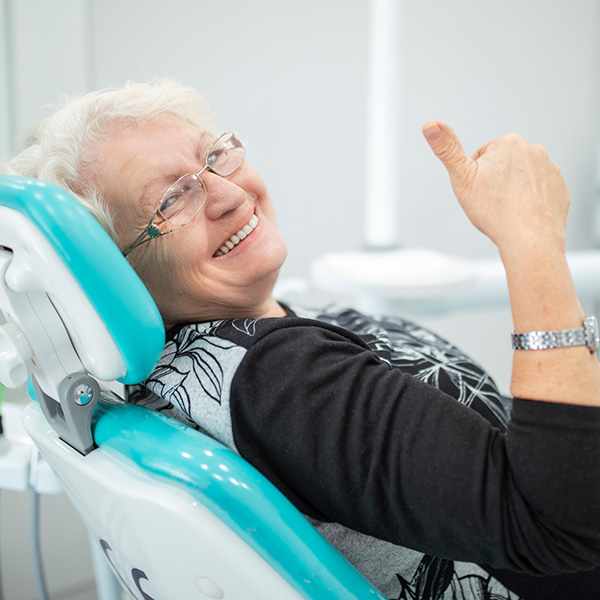 lady at dental office smiling