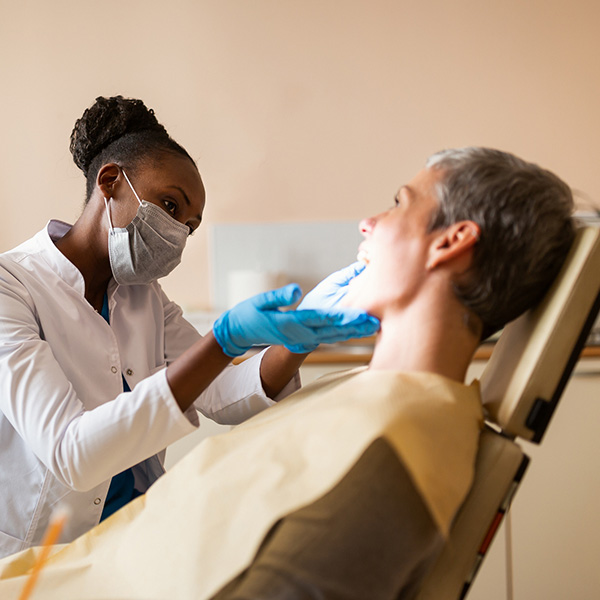 dentist and patient in dental chair
