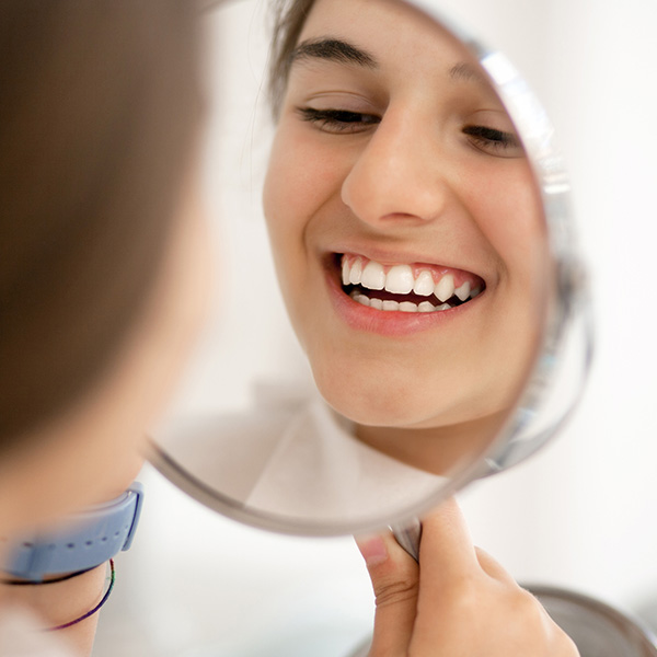 lady smiling in mirror